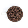 A cup full of whole bean Arabica coffee Decaf Colombia full city